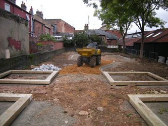 Grapes Hill Community Garden - Putting in raised bed foundations and granite setts