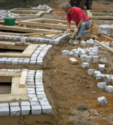 Grapes Hill Community Garden - Putting in raised bed foundations and granite setts